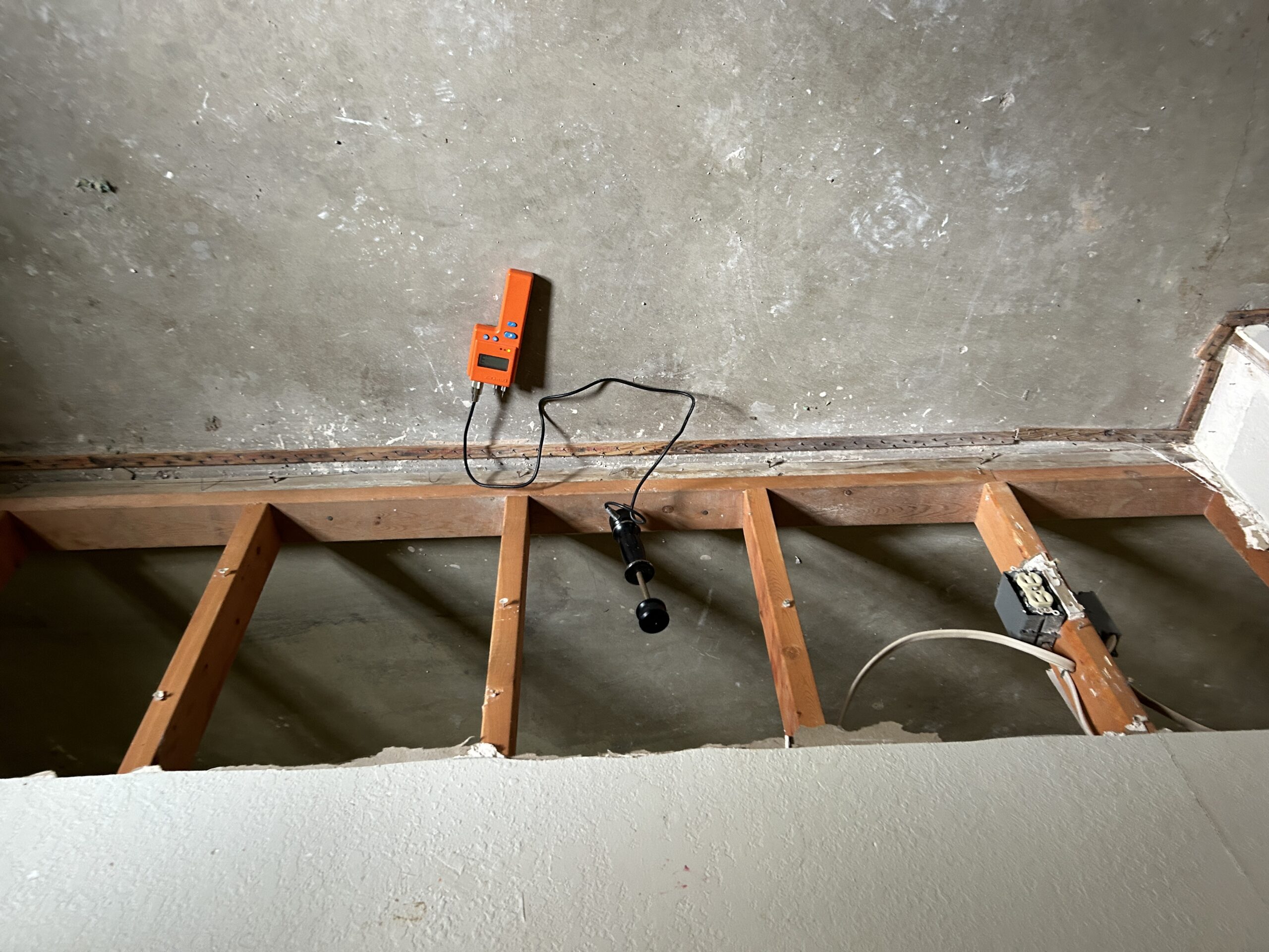 Monitoring equipment attached to floor framing
